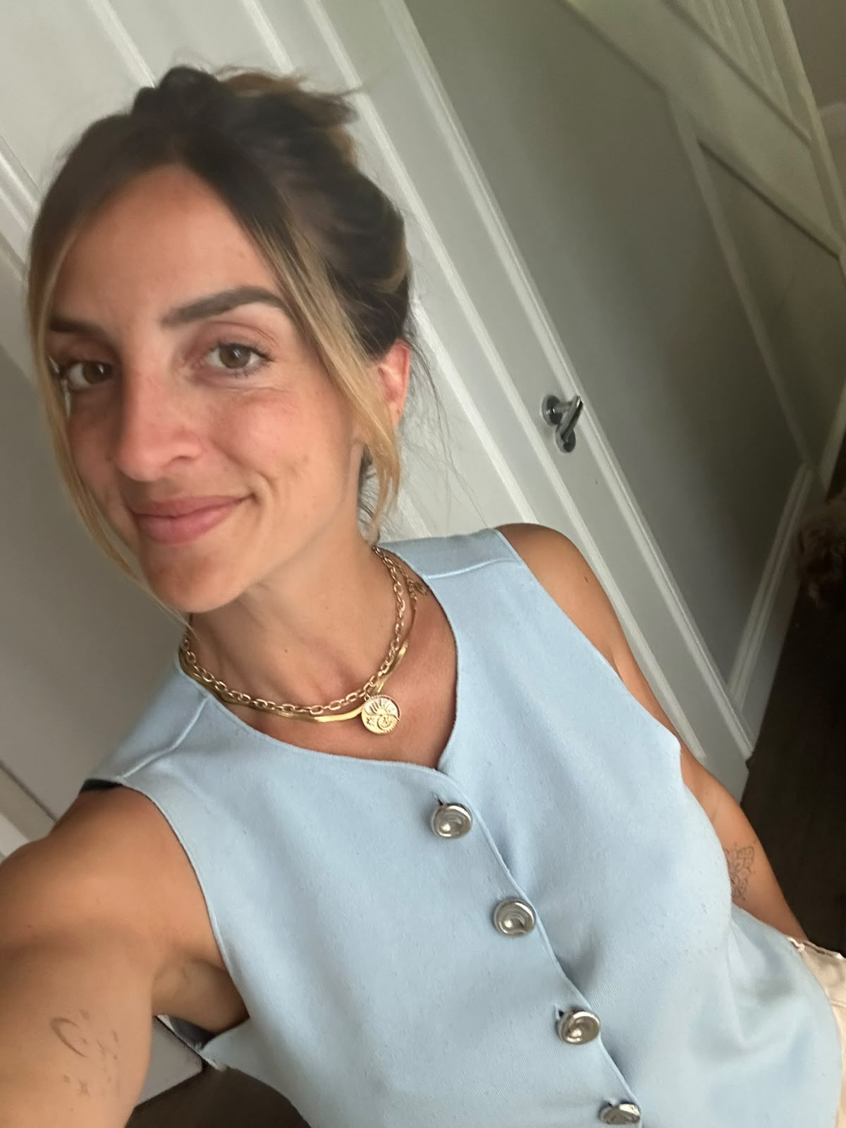 Francesca, the Lymington Spray Tans technician, in a pale blue top